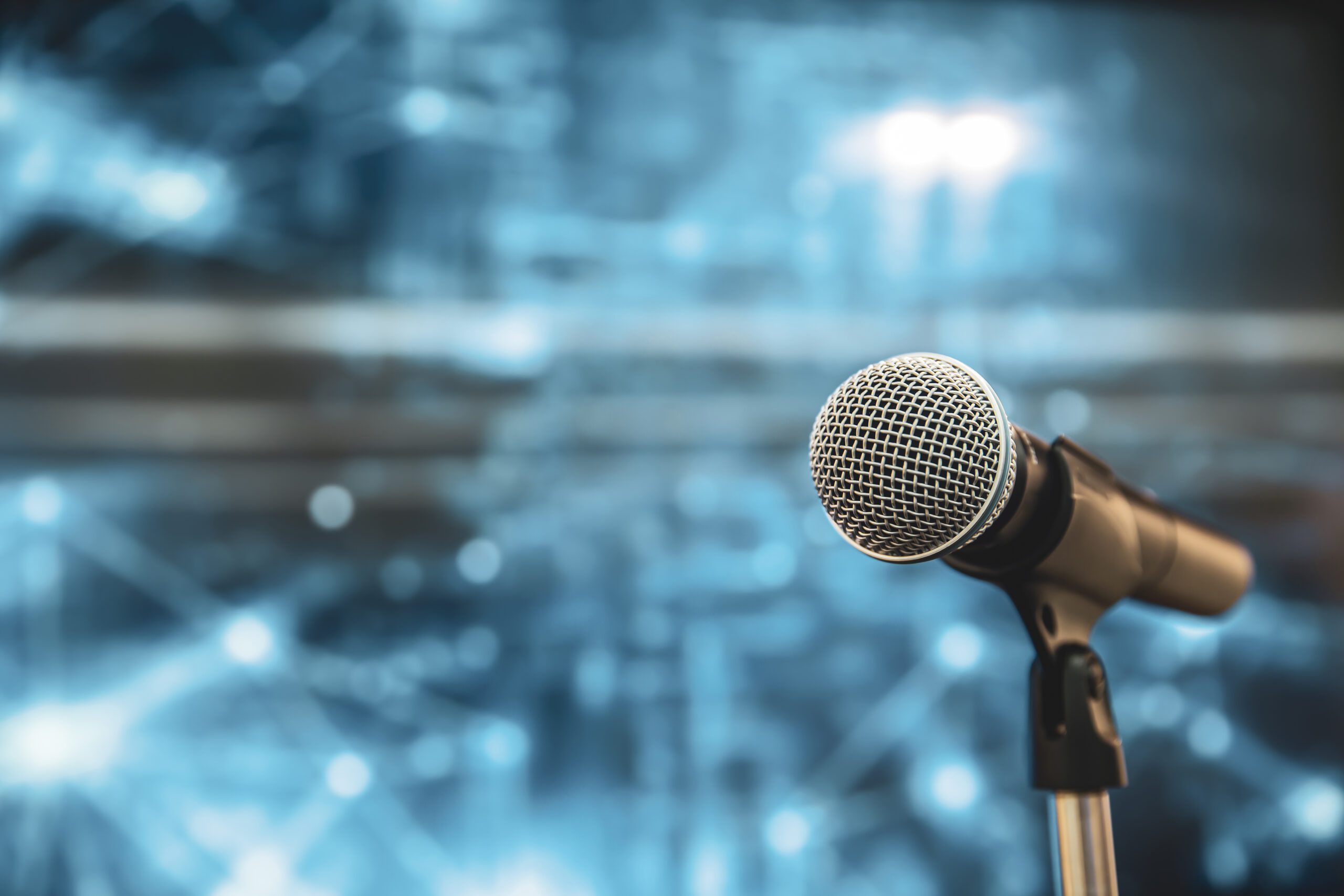 Public,Speaking,Backgrounds,,Close-up,The,Microphone,On,Stand,For,Speaker